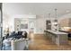 Bright, open-concept living space features modern furnishings and a kitchen island with barstool seating at 520 Wabash Ne Ave, Atlanta, GA 30312