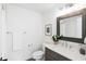 Cozy bathroom features stylish vanity, tiled floor, and framed mirror at 520 Wabash Ne Ave # B, Atlanta, GA 30312