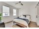 Inviting bedroom with hardwood floors, a ceiling fan, and a convenient sliding door at 520 Wabash Ne Ave # B, Atlanta, GA 30312