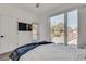 Bedroom with a view, tv, hardwood floors and neutral decor at 520 Wabash Ne Ave # B, Atlanta, GA 30312