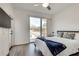 Bedroom with a view, tv, hardwood floors and neutral decor at 520 Wabash Ne Ave # B, Atlanta, GA 30312
