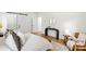 Bright bedroom featuring hardwood floors, a modern console table, and a stylish upholstered chair at 520 Wabash Ne Ave # B, Atlanta, GA 30312