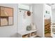 Functional entryway with a bench, storage baskets, coat hooks, and modern decor at 520 Wabash Ne Ave # B, Atlanta, GA 30312