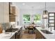Bright, modern kitchen featuring stainless steel appliances, quartz countertops and a view to the dining area at 520 Wabash Ne Ave # B, Atlanta, GA 30312