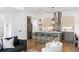 Bright, modern kitchen featuring stainless steel appliances, a center island with seating, and stylish pendant lighting at 520 Wabash Ne Ave # B, Atlanta, GA 30312