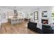 Open concept living and dining areas, and modern kitchen with island and bar seating at 520 Wabash Ne Ave # B, Atlanta, GA 30312