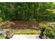 A backyard view shows a wooded area, giving a sense of privacy and a connection to nature at 1914 Lakeshore Overlook Nw Cir, Kennesaw, GA 30152