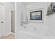 Bathroom featuring a shower with a glass door, a soaking tub, and a framed picture at 1914 Lakeshore Overlook Nw Cir, Kennesaw, GA 30152