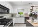 Modern kitchen featuring white cabinets, stainless steel appliances, and plenty of counter space at 1914 Lakeshore Overlook Nw Cir, Kennesaw, GA 30152