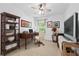 An office with a wooden desk, a bookcase, neutral walls, and a window bringing in natural light at 1914 Lakeshore Overlook Nw Cir, Kennesaw, GA 30152