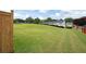 Large backyard provides ample space for outdoor activities and entertaining with community views at 212 Regent Sq, Woodstock, GA 30188