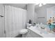 Bathroom featuring a tub with shower, neutral walls and a single sink at 212 Regent Sq, Woodstock, GA 30188