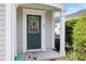 Close up on an inviting front door with wreath and stylish welcome mat and address number at 212 Regent Sq, Woodstock, GA 30188