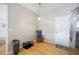 Cozy kitchen nook features hardwood floors, door to the exterior, and room for a rocking chair at 212 Regent Sq, Woodstock, GA 30188