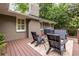 Cozy deck with seating, outdoor dining, and a barbecue grill for backyard get-togethers at 2469 Elizabeth Ann Ne Ln, Atlanta, GA 30324