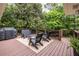 Spacious wooden deck area with an outdoor kitchen, perfect for grilling and enjoying nature at 2469 Elizabeth Ann Ne Ln, Atlanta, GA 30324