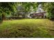 Lush, expansive backyard with mature trees, offering privacy and space at 2469 Elizabeth Ann Ne Ln, Atlanta, GA 30324
