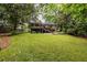 Spacious backyard with mature trees, offering privacy and room for outdoor activities at 2469 Elizabeth Ann Ne Ln, Atlanta, GA 30324