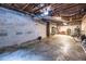 Unfinished basement with concrete floors, showing utilities, storage potential, and ample space at 2469 Elizabeth Ann Ne Ln, Atlanta, GA 30324