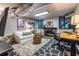 Finished basement with a cozy fireplace, comfortable seating, and a dedicated workspace at 2469 Elizabeth Ann Ne Ln, Atlanta, GA 30324