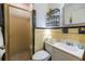 Bathroom featuring colorful tile, a glass shower, and a built-in toiletries rack at 2469 Elizabeth Ann Ne Ln, Atlanta, GA 30324