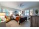 Comfortable bedroom with neutral carpet, lots of lighting, light-colored walls, and large windows with bright shutters at 2469 Elizabeth Ann Ne Ln, Atlanta, GA 30324