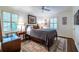 Comfortable bedroom featuring a ceiling fan, a bedside table, and a decorative rug at 2469 Elizabeth Ann Ne Ln, Atlanta, GA 30324