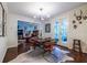 Inviting dining room that opens to a living room with a view to the kitchen with warm lighting at 2469 Elizabeth Ann Ne Ln, Atlanta, GA 30324