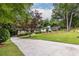 Charming home with a long driveway and lush green lawn, showcasing curb appeal at 2469 Elizabeth Ann Ne Ln, Atlanta, GA 30324