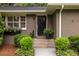 Inviting front entrance with stylish door, complemented by lush greenery and decorative accents, creating a warm welcome at 2469 Elizabeth Ann Ne Ln, Atlanta, GA 30324