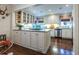 Bright eat-in kitchen with white cabinets, stainless steel appliances, and a center island with cooktop at 2469 Elizabeth Ann Ne Ln, Atlanta, GA 30324