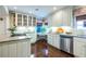 Charming kitchen featuring an eat-in breakfast nook, white cabinetry, stone countertops, and stainless appliances at 2469 Elizabeth Ann Ne Ln, Atlanta, GA 30324