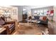 Bright living room showcasing hardwood floors, chic decor, and open layout, seamlessly connecting to dining area at 2469 Elizabeth Ann Ne Ln, Atlanta, GA 30324