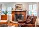 Intimate fireplace area with a classic mantel and comfortable seating, designed for cozy evenings and relaxation at 2469 Elizabeth Ann Ne Ln, Atlanta, GA 30324