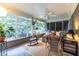 Inviting screened-in porch featuring a daybed, wicker furniture, and natural light at 2469 Elizabeth Ann Ne Ln, Atlanta, GA 30324