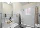 Bright bathroom features white tiling and vintage gold fixtures at 416 2Nd Ave, Decatur, GA 30030