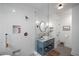 Bathroom featuring a glass shower, white subway tiles, and a blue vanity at 416 2Nd Ave, Decatur, GA 30030