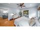 Bedroom featuring hardwood floors and access to a screened-in porch and living room at 416 2Nd Ave, Decatur, GA 30030
