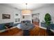 Dining room features hardwood floors, a round table, and an elegant chandelier at 416 2Nd Ave, Decatur, GA 30030