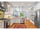 Well-appointed kitchen with stainless steel appliances, generous counter space, and hardwood floors at 416 2Nd Ave, Decatur, GA 30030