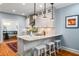 Modern kitchen with granite countertops, stainless steel sink, and breakfast bar at 416 2Nd Ave, Decatur, GA 30030