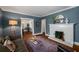 Bright living room featuring a fireplace, hardwood floors, and an open layout at 416 2Nd Ave, Decatur, GA 30030