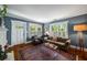 Comfortable living room with stylish rug, couch, natural light, and fireplace at 416 2Nd Ave, Decatur, GA 30030