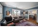 Cozy living room with large windows, comfortable seating, and an open floor plan at 416 2Nd Ave, Decatur, GA 30030