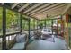 Spacious screened-in porch with comfortable seating and serene outdoor views at 416 2Nd Ave, Decatur, GA 30030