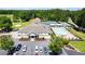 Aerial shot showcasing the clubhouse, parking, and adjacent golf course and tennis facilities at 1094 Plantation Ct, Villa Rica, GA 30180