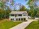 Charming single-story home with well-manicured lawn and inviting front porch at 1094 Plantation Ct, Villa Rica, GA 30180
