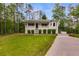 Well-maintained one-story home featuring a cozy front porch and lush green lawn at 1094 Plantation Ct, Villa Rica, GA 30180