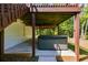 Hot tub under a deck offering a relaxing outdoor experience surrounded by trees at 1094 Plantation Ct, Villa Rica, GA 30180