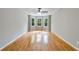 Spacious living room features hardwood floors, a ceiling fan, and a bright bay window at 1094 Plantation Ct, Villa Rica, GA 30180